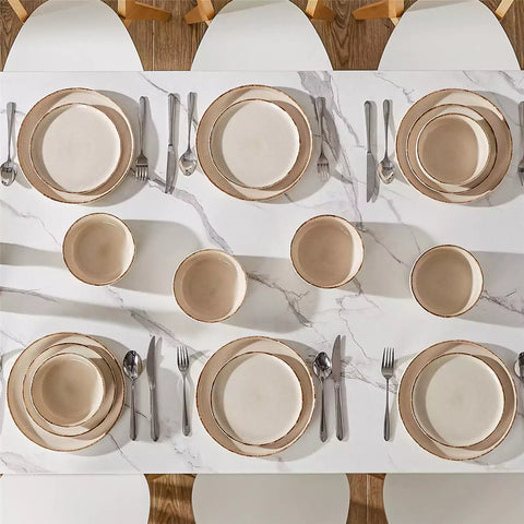 Plays 18-piece stoneware dinnerware set with steak and vegetables on marble table - featuring sandy speckled plates and bowls with brown rims-vancasso