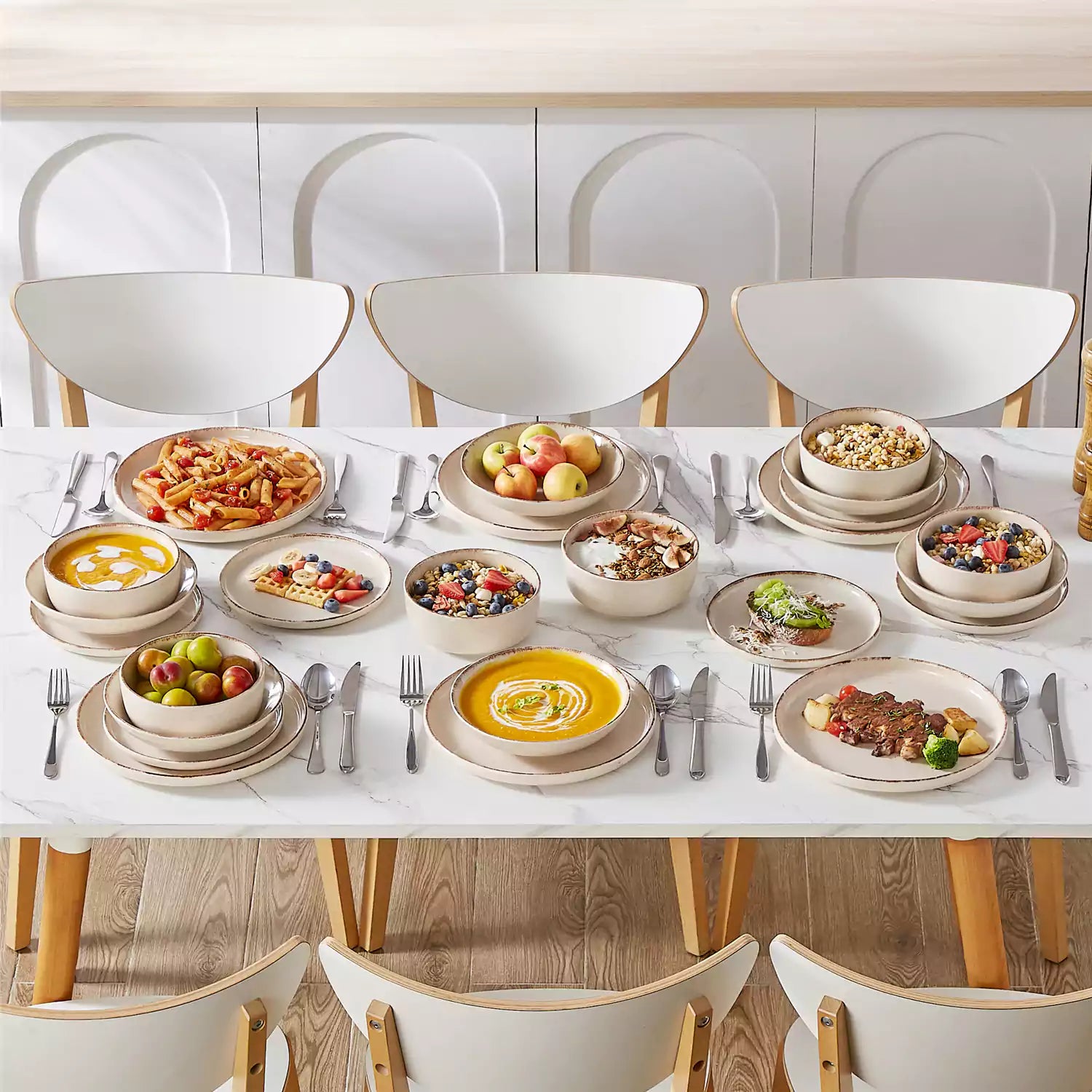 Plays 24-piece stoneware dinnerware set with pasta - soup - and fruit waffle on marble table - featuring sandy speckled plates and bowls with brown rims-vancasso