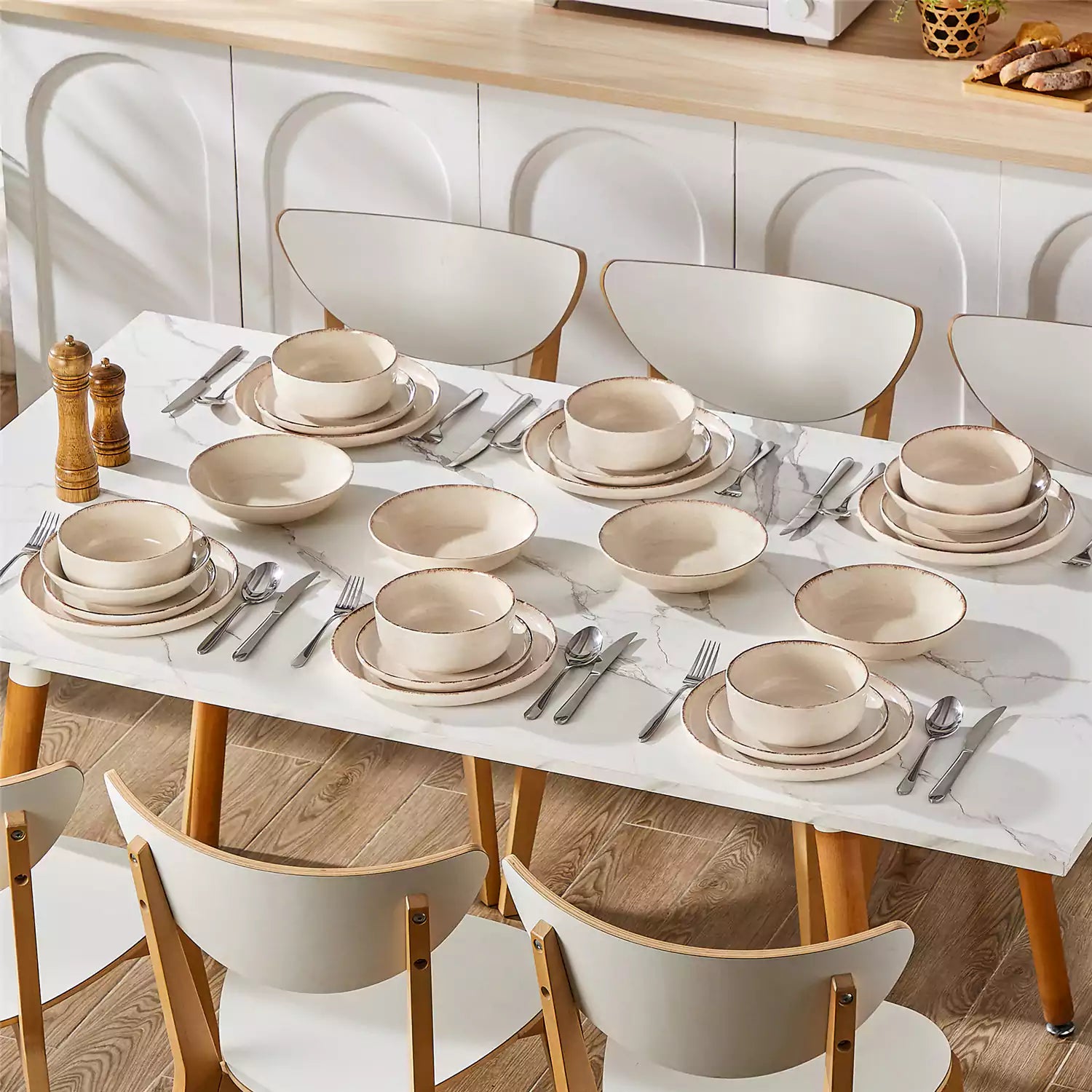 Plays 24-piece stoneware dinnerware set with pasta - soup - and fruit waffle on marble table - featuring sandy speckled plates and bowls with brown rims-vancasso