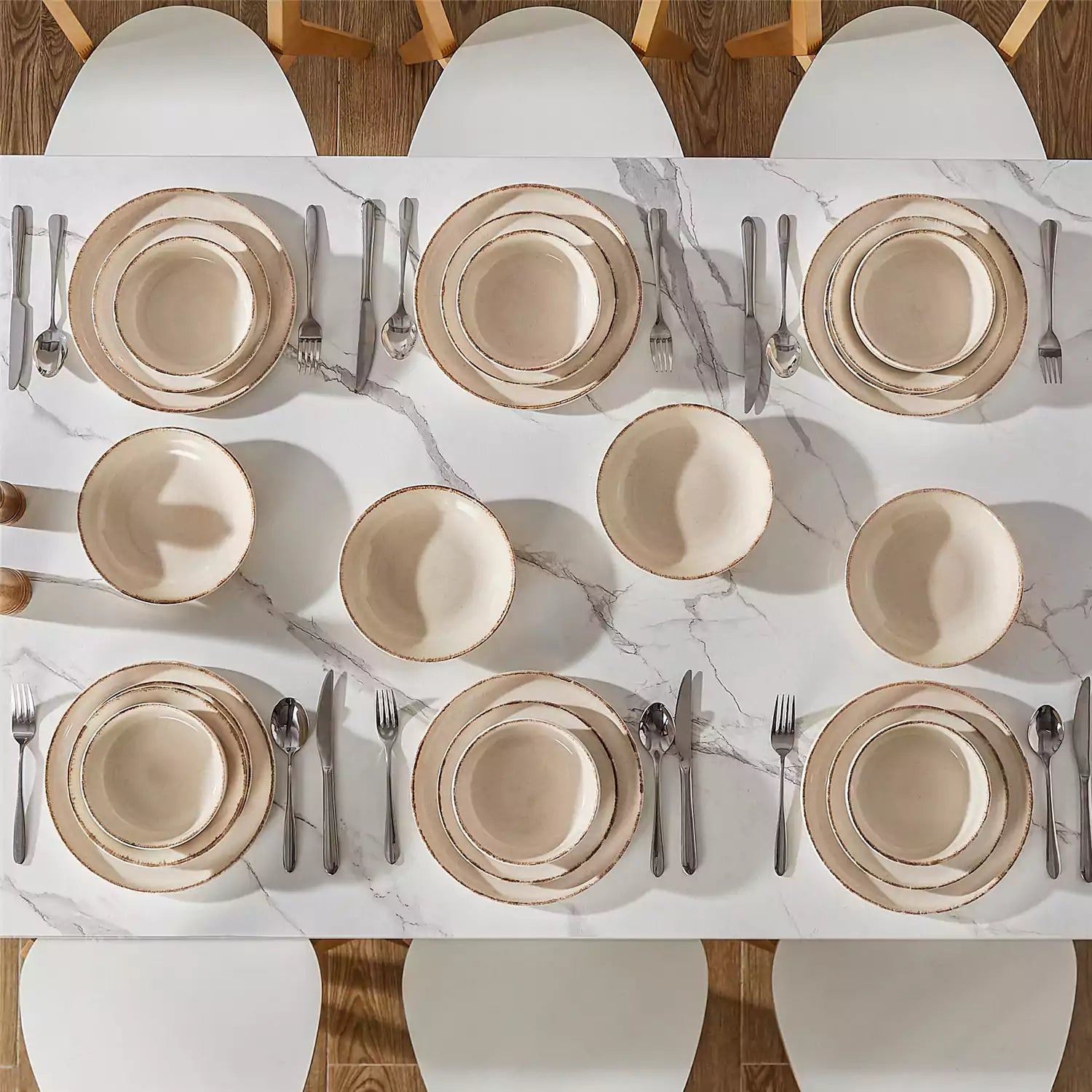 Plays 24-piece stoneware dinnerware set with pasta - soup - and fruit waffle on marble table - featuring sandy speckled plates and bowls with brown rims-vancasso