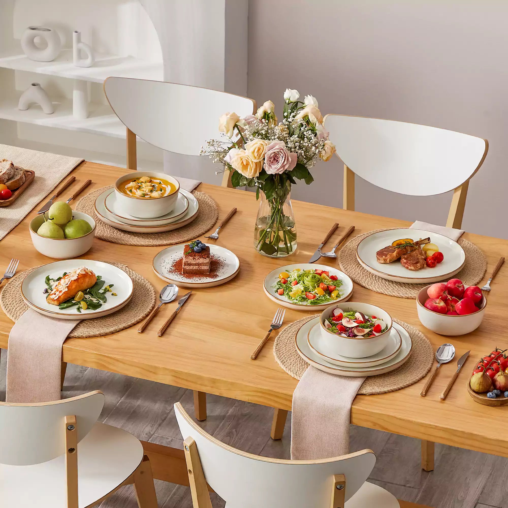 Beige rustic stoneware dinnerware set with speckled - lipped-edge plates and bowls on a dining table with flowers and cutlery in a cozy modern kitchen-vancasso