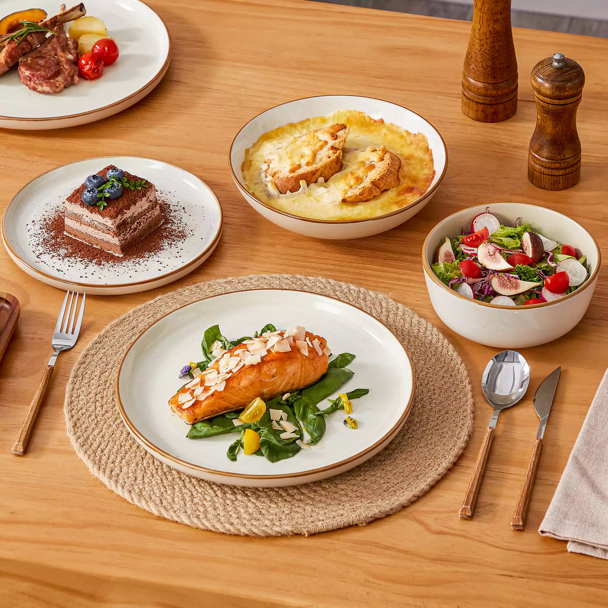 Rustic beige speckled stoneware dinnerware set with lipped-edge plates and bowls arranged on a sunlit modern dining table-vancasso