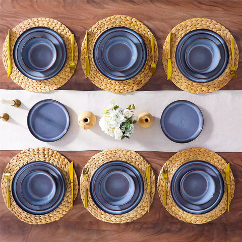 Sata blue stoneware dinnerware set styled dining table with dinner plates salad plates pasta bowls cereal bowls silverware and floral centerpiece farmhouse reactive glaze service for 6