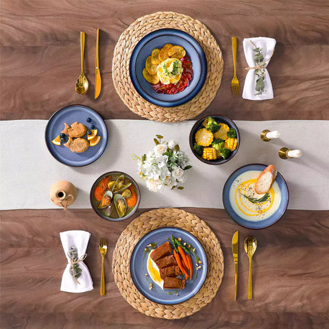 Sata blue stoneware dinnerware set styled dining table with dinner plates salad plates pasta bowls cereal bowls silverware and floral centerpiece farmhouse reactive glaze service for 6