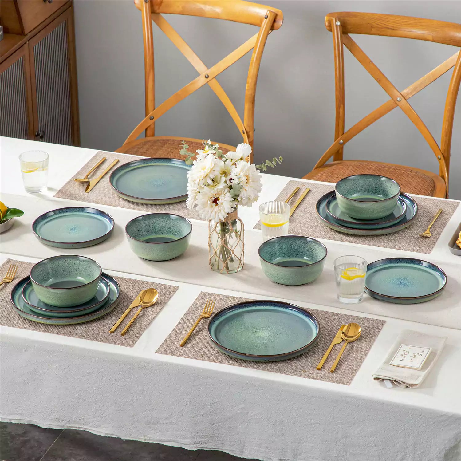 Sata green stoneware 12 piece dinnerware set with dinner plates salad plates and cereal bowls styled with gold cutlery on textured surface farmhouse reactive glaze lipped edge service for 4