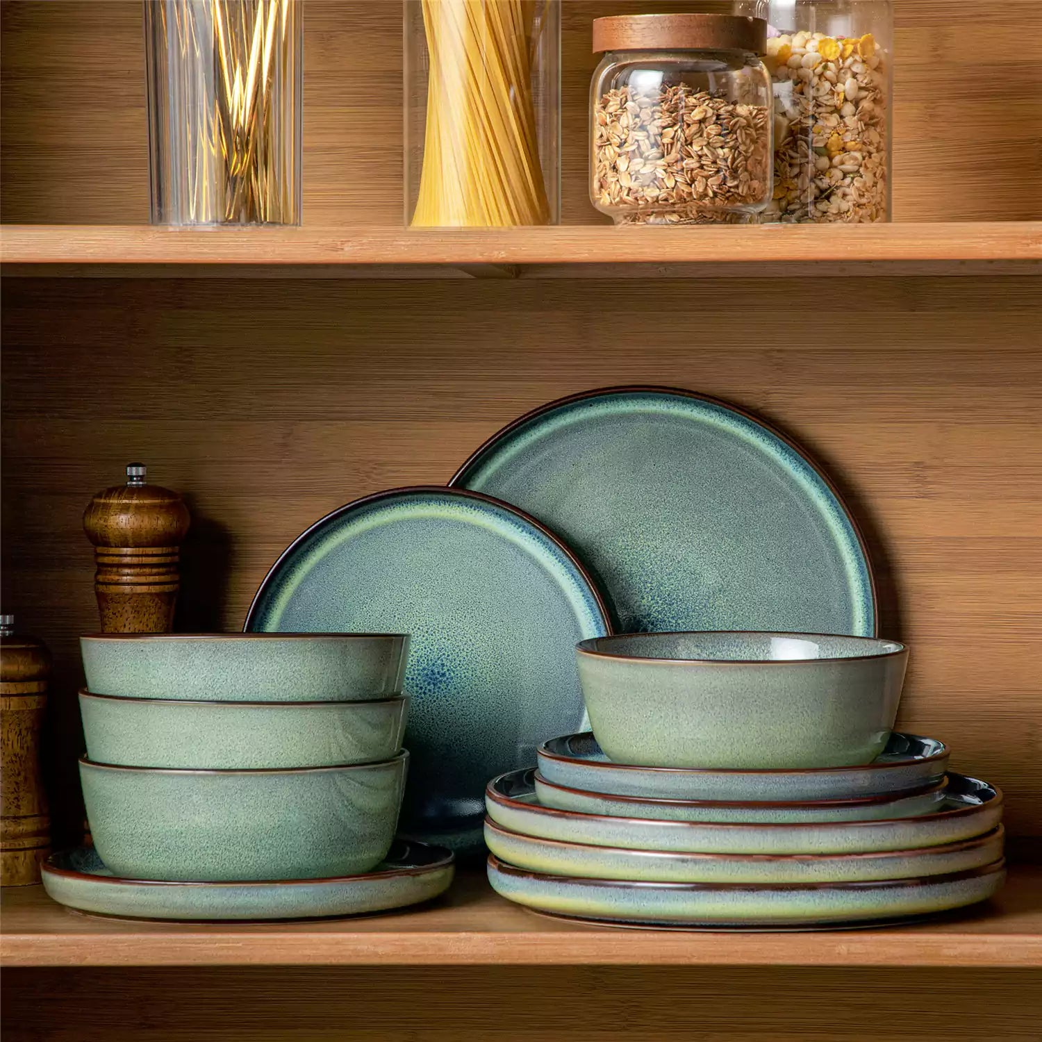Sata green stoneware 12 piece dinnerware set with dinner plates salad plates and cereal bowls styled with gold cutlery on textured surface farmhouse reactive glaze lipped edge service for 4