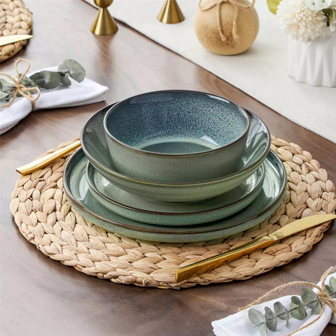 Sata green stoneware dinnerware set styled dining table with dinner plates salad plates pasta bowls cereal bowls silverware and floral centerpiece farmhouse reactive glaze service for 6