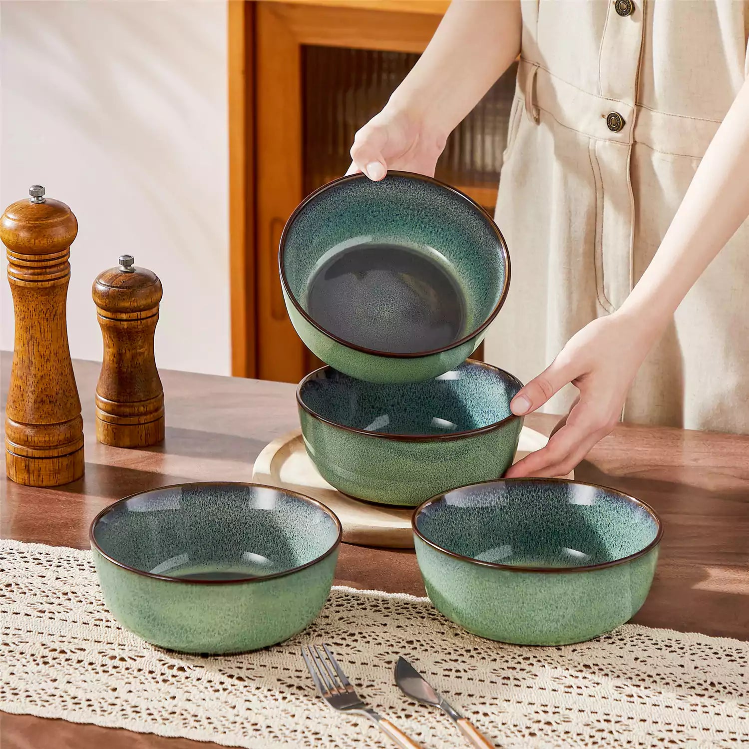Sata green stoneware cereal bowls set of 4 with assorted meals styled on a wooden table with lace tablecloth farmhouse reactive glaze lipped edge artisan finish