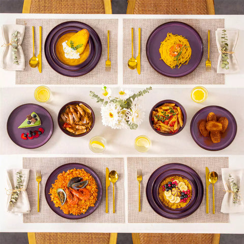 Sata purple stoneware 12 piece dinnerware set with dinner plates salad plates and cereal bowls styled with gold cutlery on textured surface farmhouse reactive glaze lipped edge service for 4