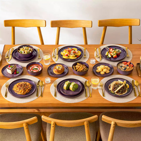 Sata purple stoneware 18 piece dinnerware set with dinner plates salad plates and cereal bowls styled on a wooden table with diverse meal setup farmhouse reactive glaze lipped edge service for 6