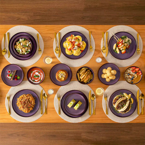 Sata purple stoneware 18 piece dinnerware set with dinner plates salad plates and cereal bowls styled on a wooden table with diverse meal setup farmhouse reactive glaze lipped edge service for 6