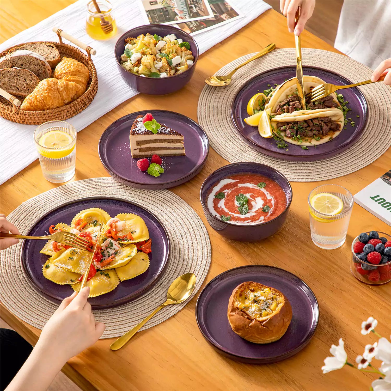 Sata purple stoneware 18 piece dinnerware set with dinner plates salad plates and cereal bowls styled on a wooden table with diverse meal setup farmhouse reactive glaze lipped edge service for 6