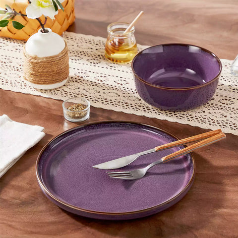 Sata purple stoneware dinner plate set of 4 styled with lamb chops and vegetables on a dinner table farmhouse lipped edge reactive glaze one of a kind finish