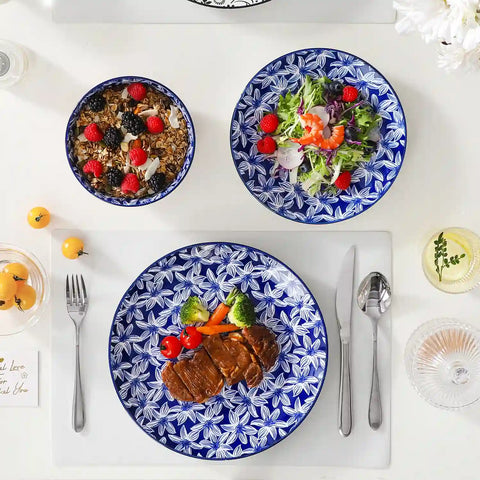 Selene porcelain 12 piece dinnerware set service for 4 vibrant floral geometric plates bowls flat lay with cutlery