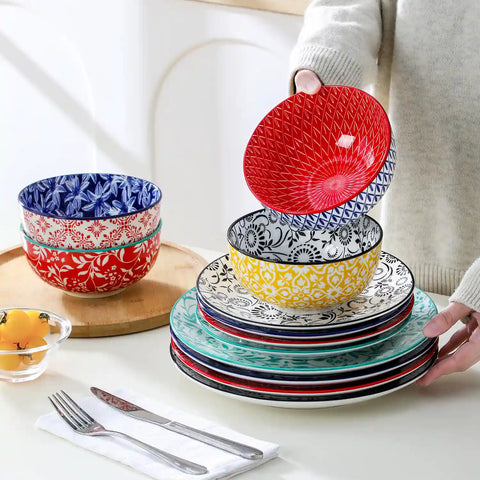 Selene porcelain 12 piece dinnerware set service for 4 vibrant floral geometric plates bowls flat lay with cutlery