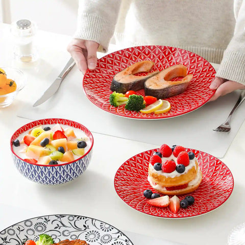 Selene porcelain 12 piece dinnerware set service for 4 vibrant floral geometric plates bowls flat lay with cutlery