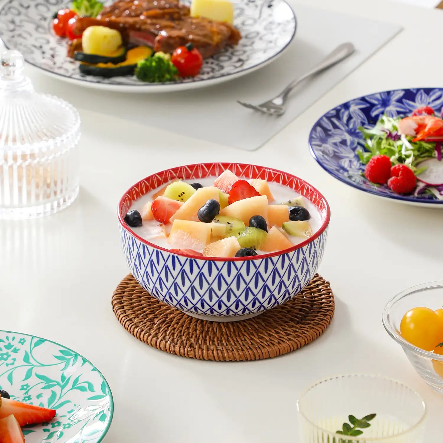 Selene porcelain 12 piece dinnerware set service for 4 vibrant floral geometric plates bowls flat lay with cutlery