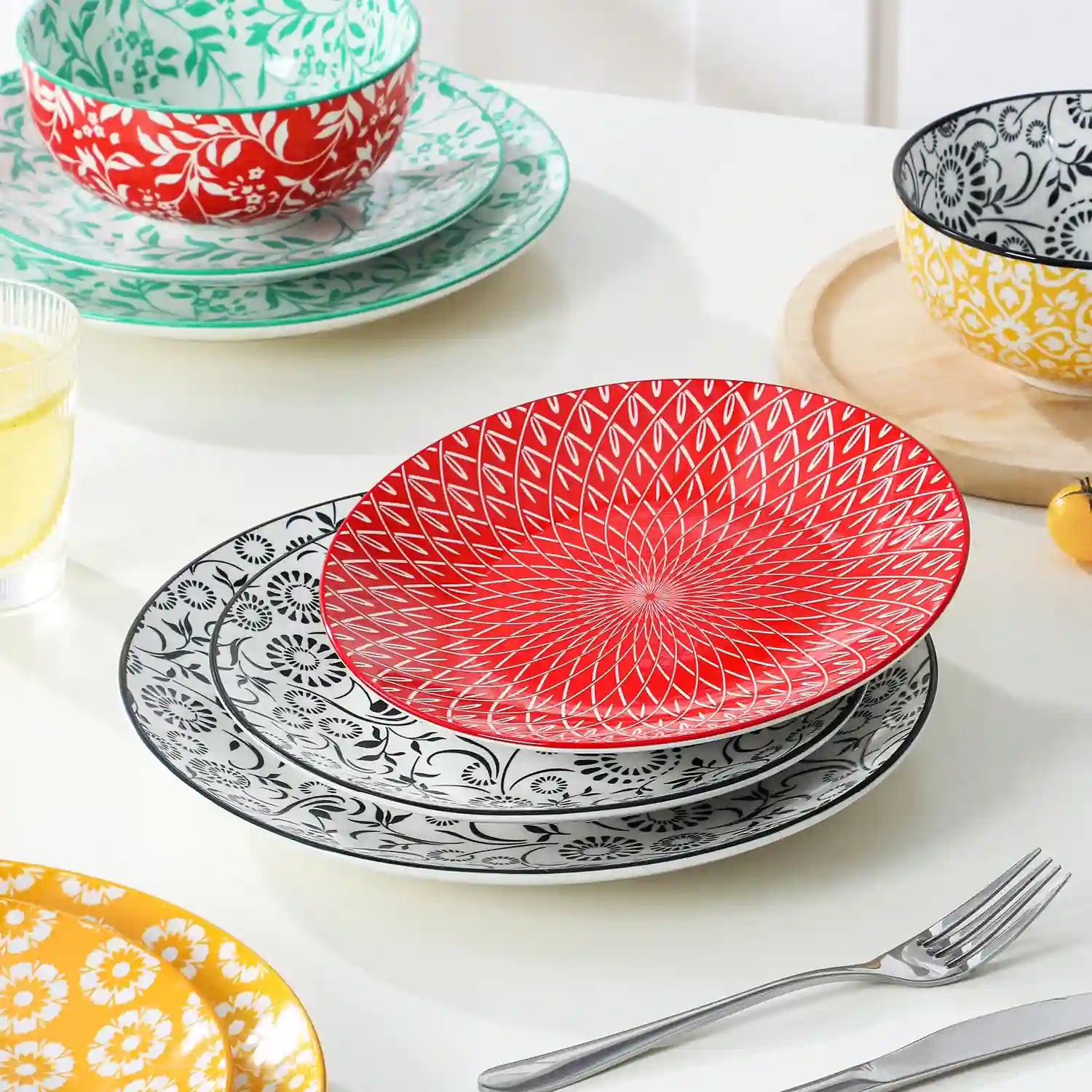 Selene porcelain vibrant dinnerware set colorful floral geometric plates bowls table setting with fork knife glass