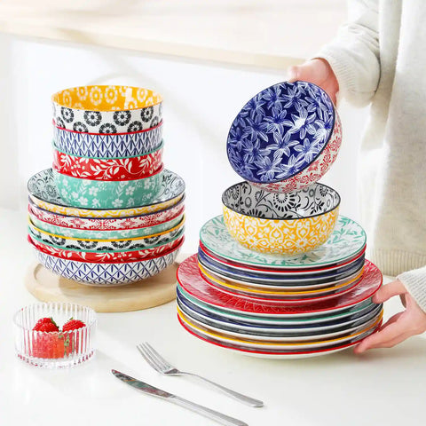 Selene porcelain 24 piece dinnerware set vibrant floral leaf pattern plates lifestyle serving scene with food