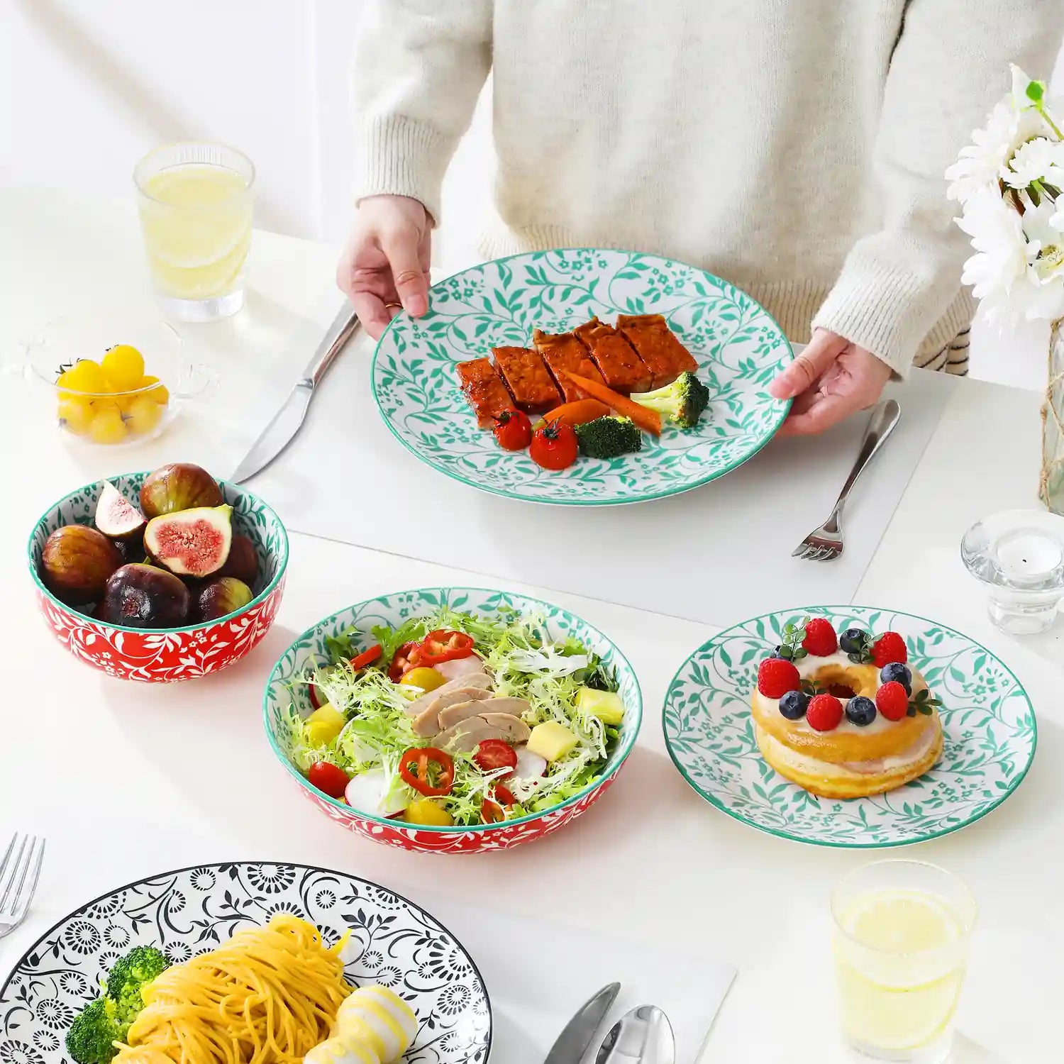 Selene porcelain 24 piece dinnerware set vibrant floral leaf pattern plates lifestyle serving scene with food