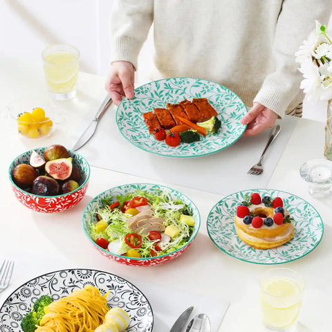 Selene porcelain 24 piece dinnerware set vibrant floral leaf pattern plates lifestyle serving scene with food