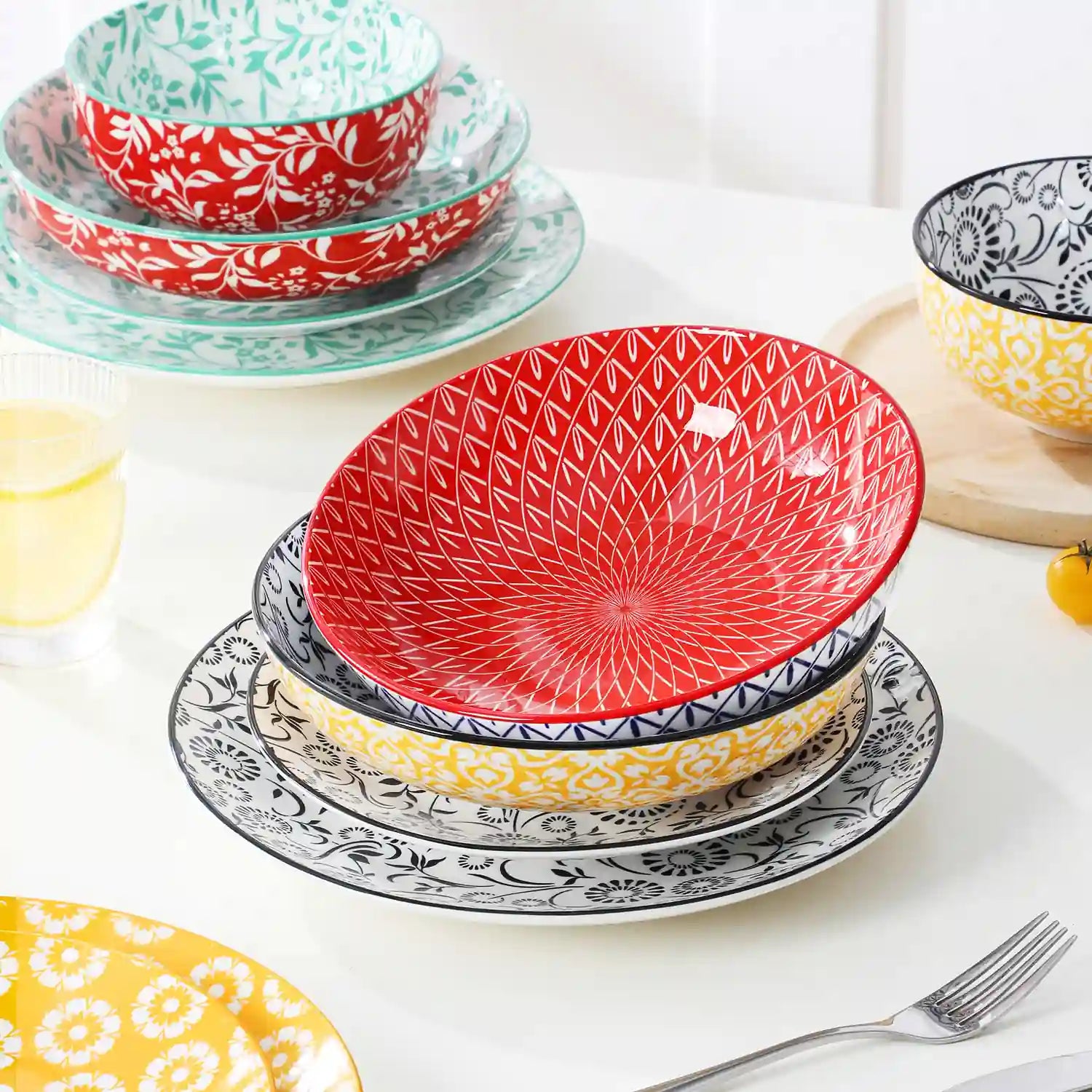 Selene porcelain 24 piece dinnerware set vibrant floral leaf pattern plates lifestyle serving scene with food