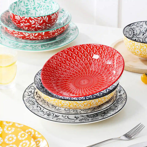 Selene porcelain 24 piece dinnerware set vibrant floral leaf pattern plates lifestyle serving scene with food