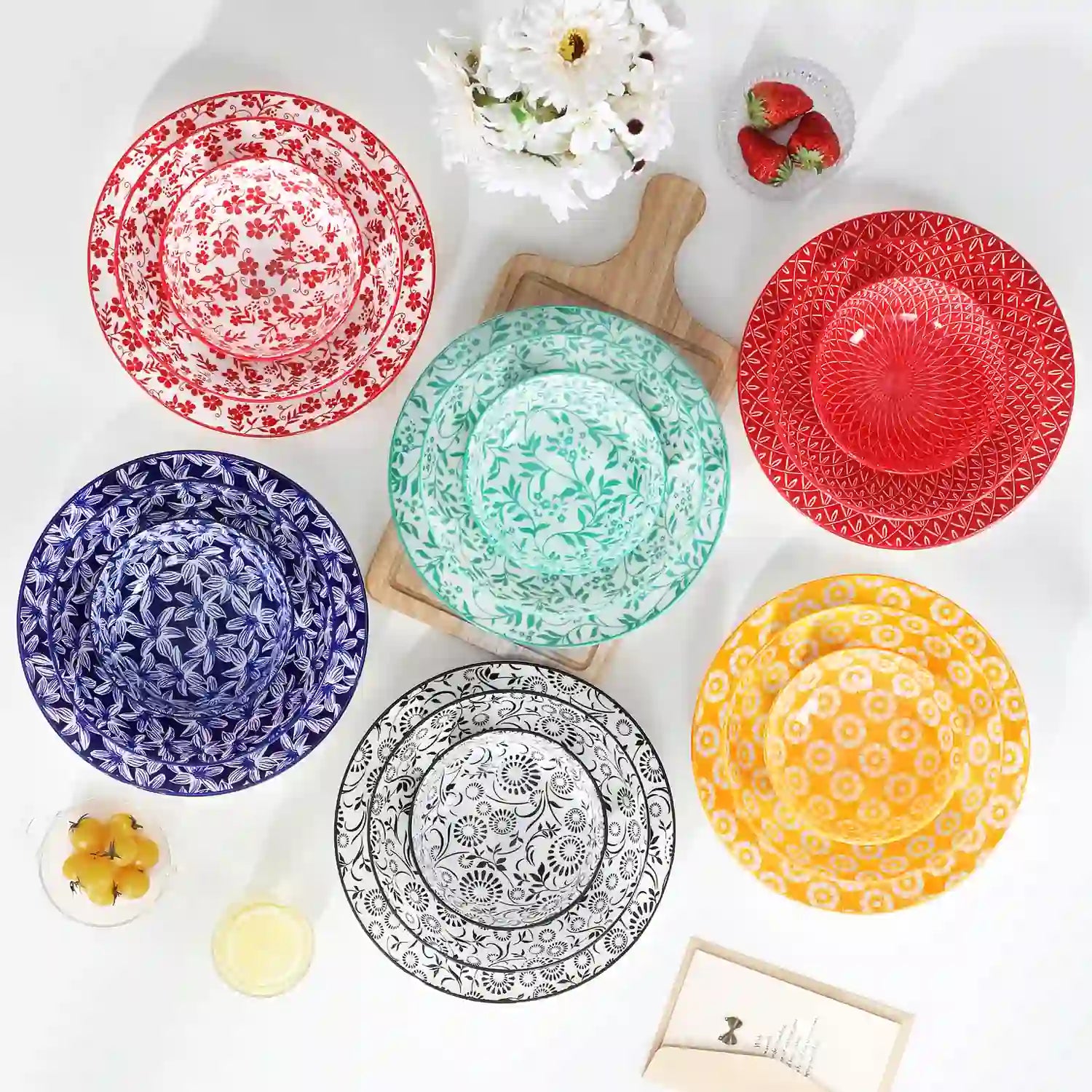 Selene porcelain 24 piece dinnerware set vibrant floral leaf pattern plates lifestyle serving scene with food