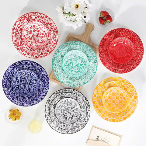 Selene porcelain 24 piece dinnerware set vibrant floral leaf pattern plates lifestyle serving scene with food