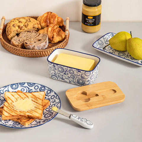 Selene porcelain butter dish Sol pattern with wood lid tabletop scene with bread and fruit