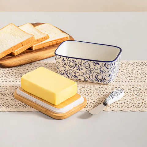 Selene porcelain butter dish Sol pattern with wood lid tabletop scene with bread and fruit