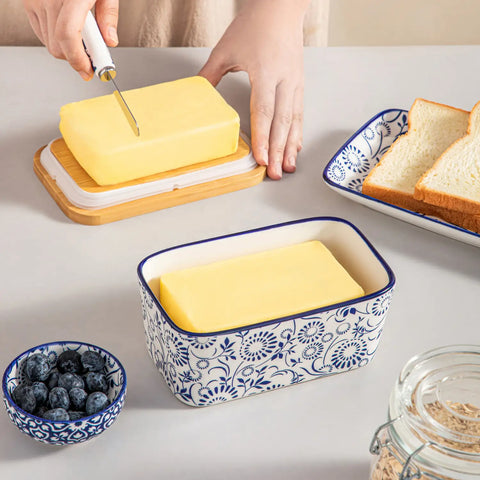 Selene porcelain butter dish Sol pattern with wood lid tabletop scene with bread and fruit