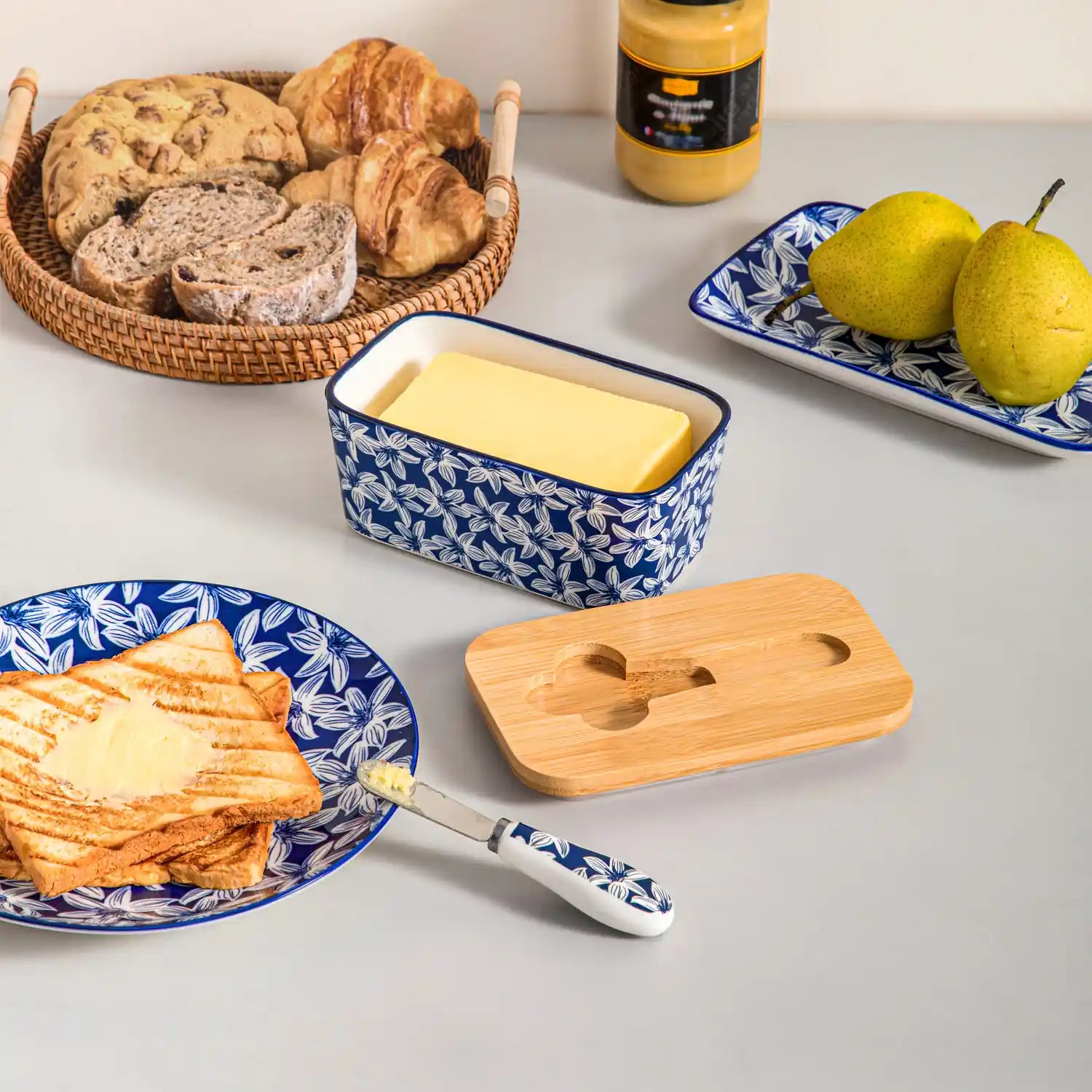 Selene porcelain butter dish Lily pattern with wood lid tabletop scene with bread and fruit