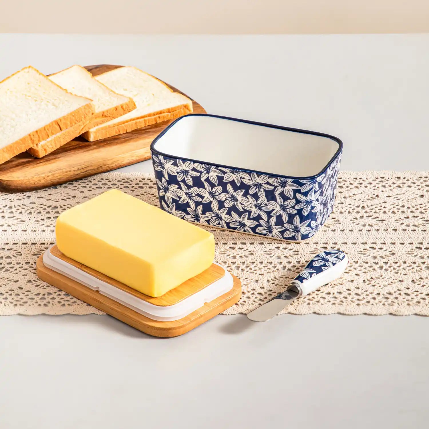 Selene porcelain butter dish Lily pattern with wood lid tabletop scene with bread and fruit