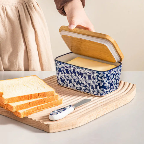 Selene porcelain butter dish Lily pattern with wood lid tabletop scene with bread and fruit