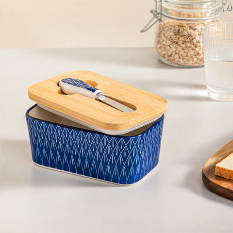 Selene porcelain butter dish Flame pattern with wood lid tabletop scene with bread and fruit