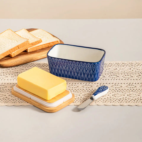 Selene porcelain butter dish Flame pattern with wood lid tabletop scene with bread and fruit