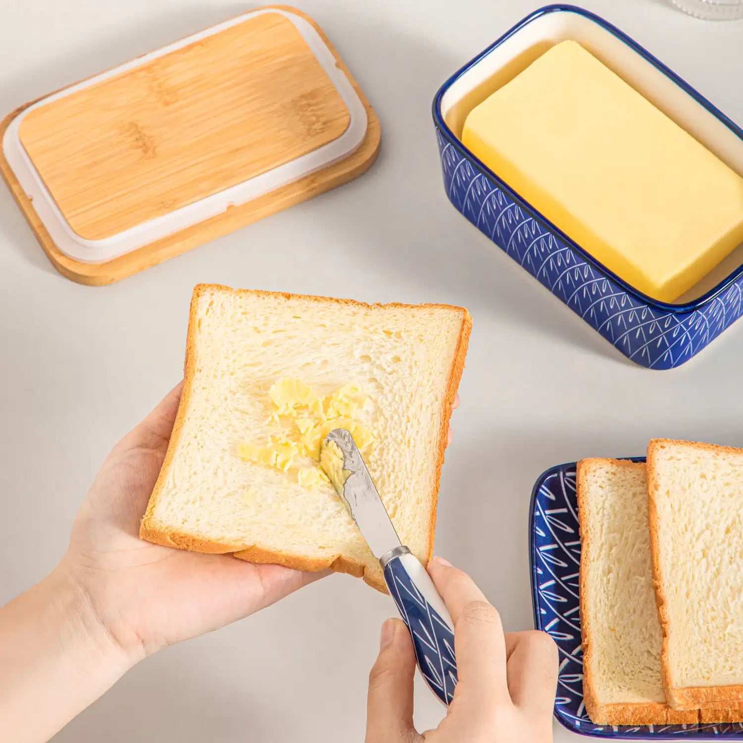 Selene porcelain butter dish Flame pattern with wood lid tabletop scene with bread and fruit
