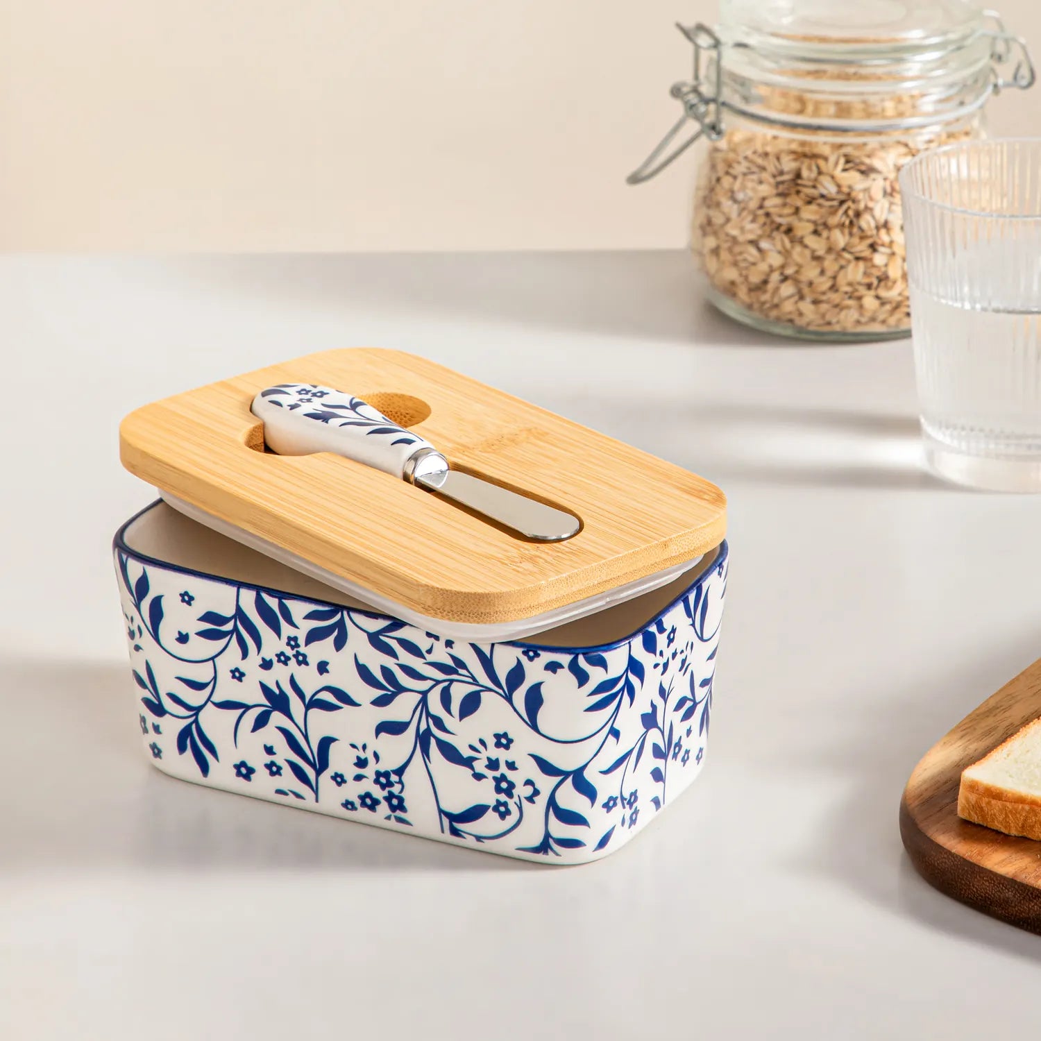 Selene porcelain butter dish Vine pattern with wood lid tabletop scene with bread and fruit