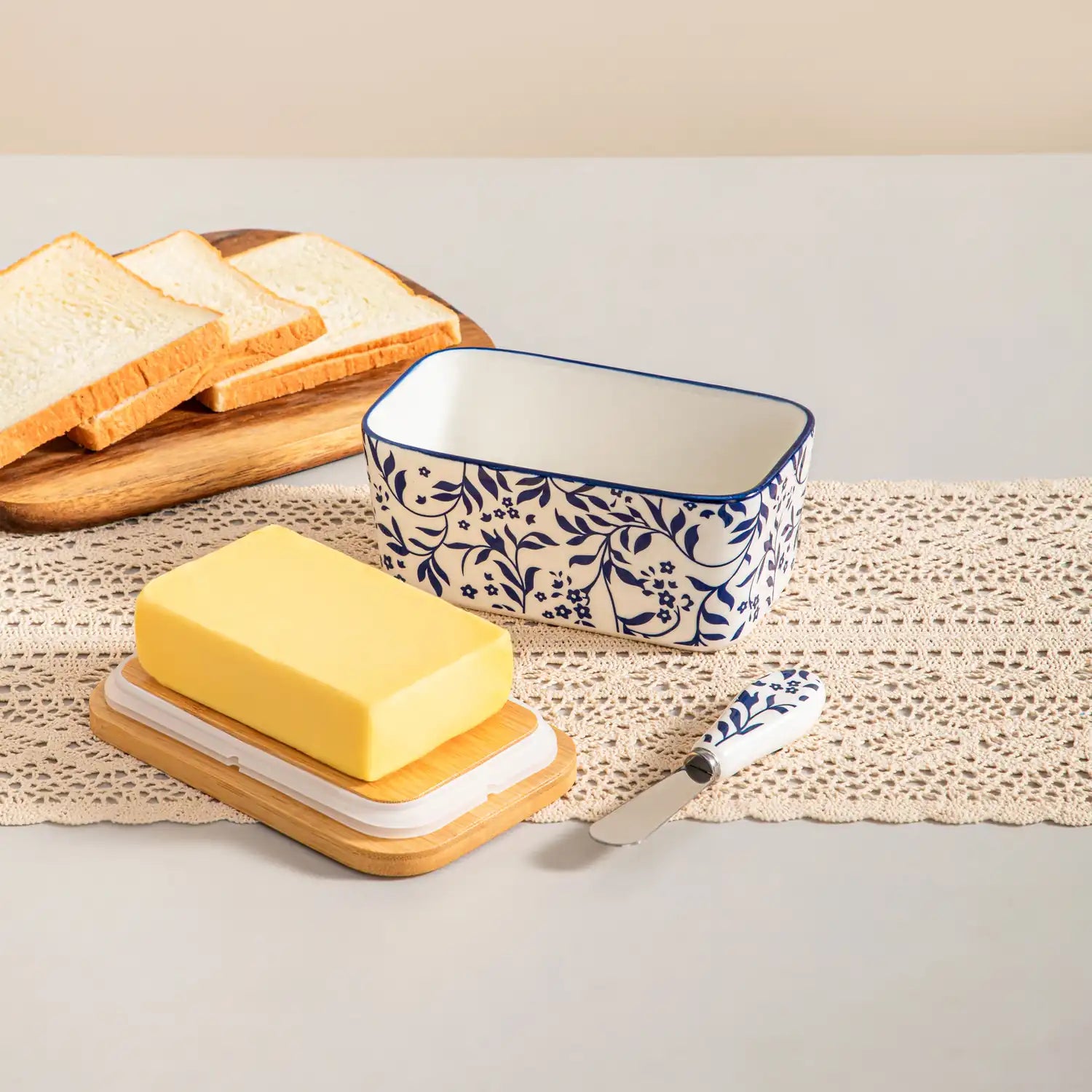 Selene porcelain butter dish Vine pattern with wood lid tabletop scene with bread and fruit