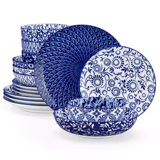 Selene 16-piece porcelain set with indigo floral and geometric patterns on plates - bowls - and mugs displayed on a dining table 1500