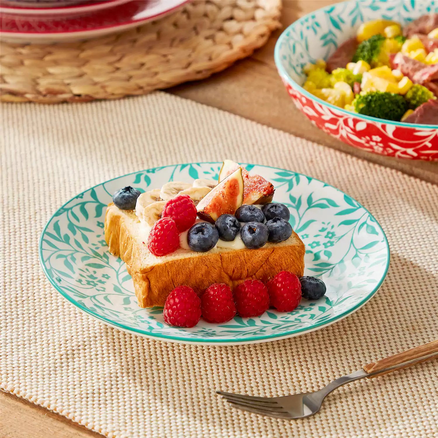 16 piece Japanese porcelain dinnerware set with indigo and earth tone floral geometric patterns on white ceramic plates and bowls