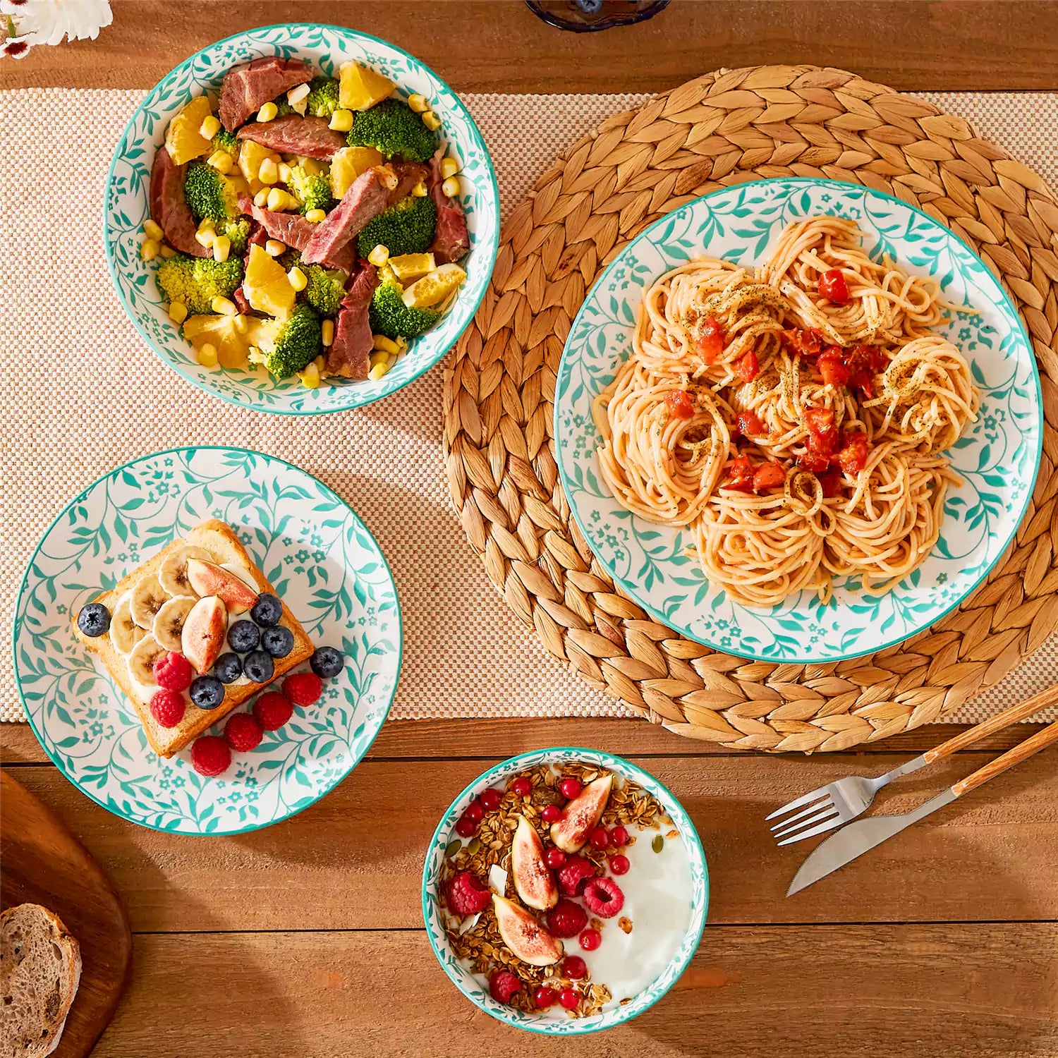 16 piece Japanese porcelain dinnerware set with indigo and earth tone floral geometric patterns on white ceramic plates and bowls