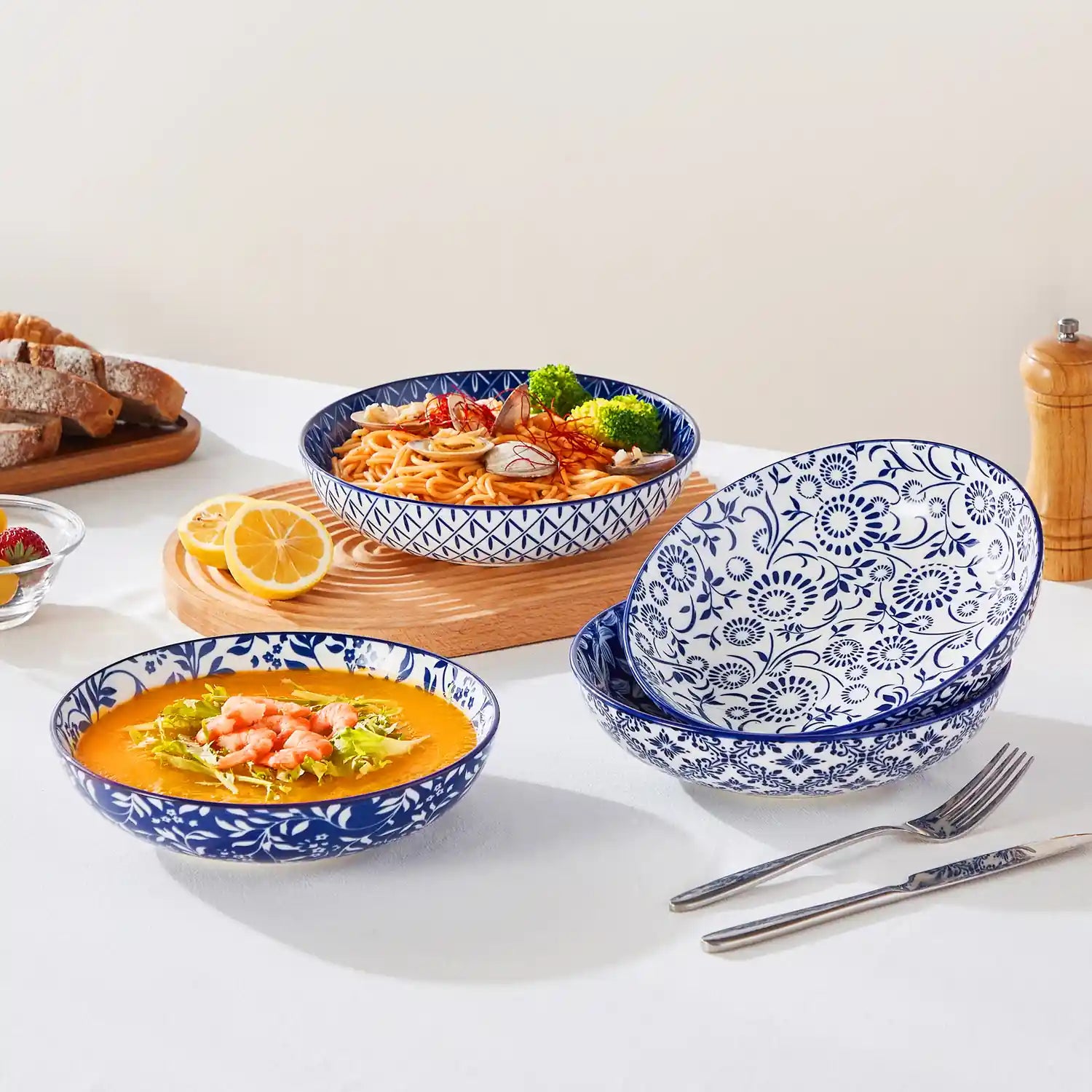 Selene porcelain indigo pasta bowls set of 4 blue white floral Japanese-inspired tabletop scene with food
