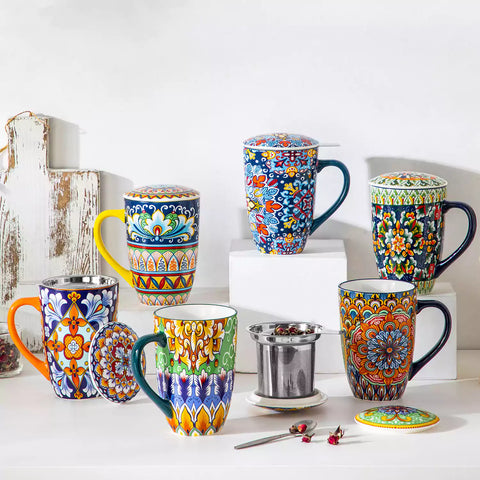 Simi tea mug with infuser and lid colorful bold orange boho chic ceramic coffee cup with spoon and loose tea leaves on white background