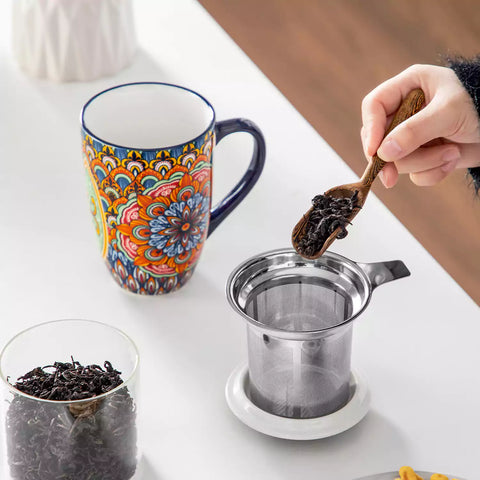 Simi tea mug with infuser and lid colorful forest green boho chic ceramic coffee cup with spoon and loose tea leaves on white background 