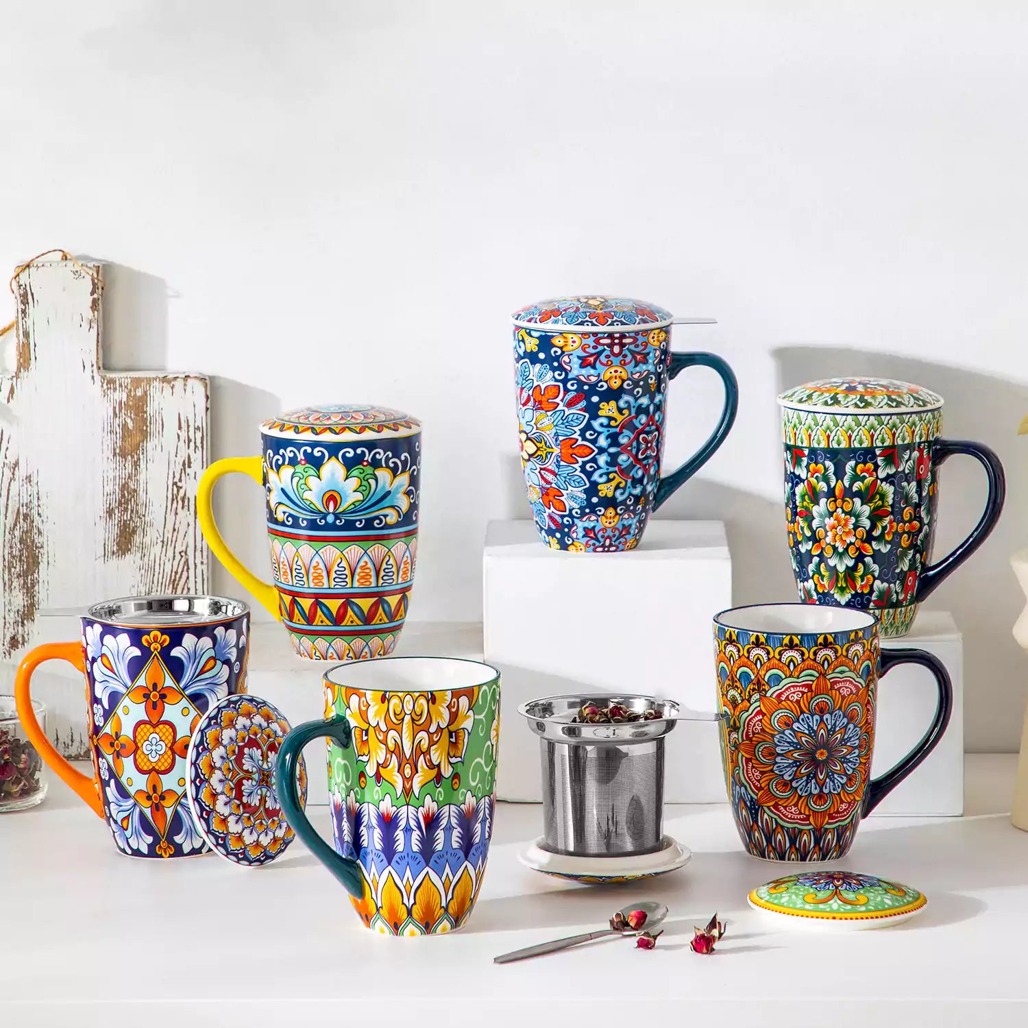 Simi tea mug with infuser and lid colorful midnight blue boho chic ceramic coffee cup with spoon and loose tea leaves on white background