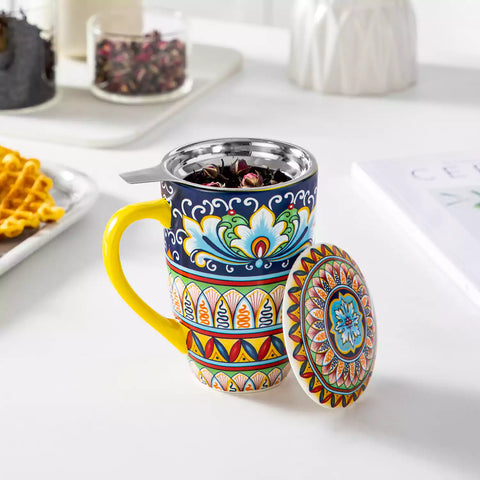 Simi tea mug with infuser and lid colorful golden yellow boho chic ceramic coffee cup with spoon and loose tea leaves on white background